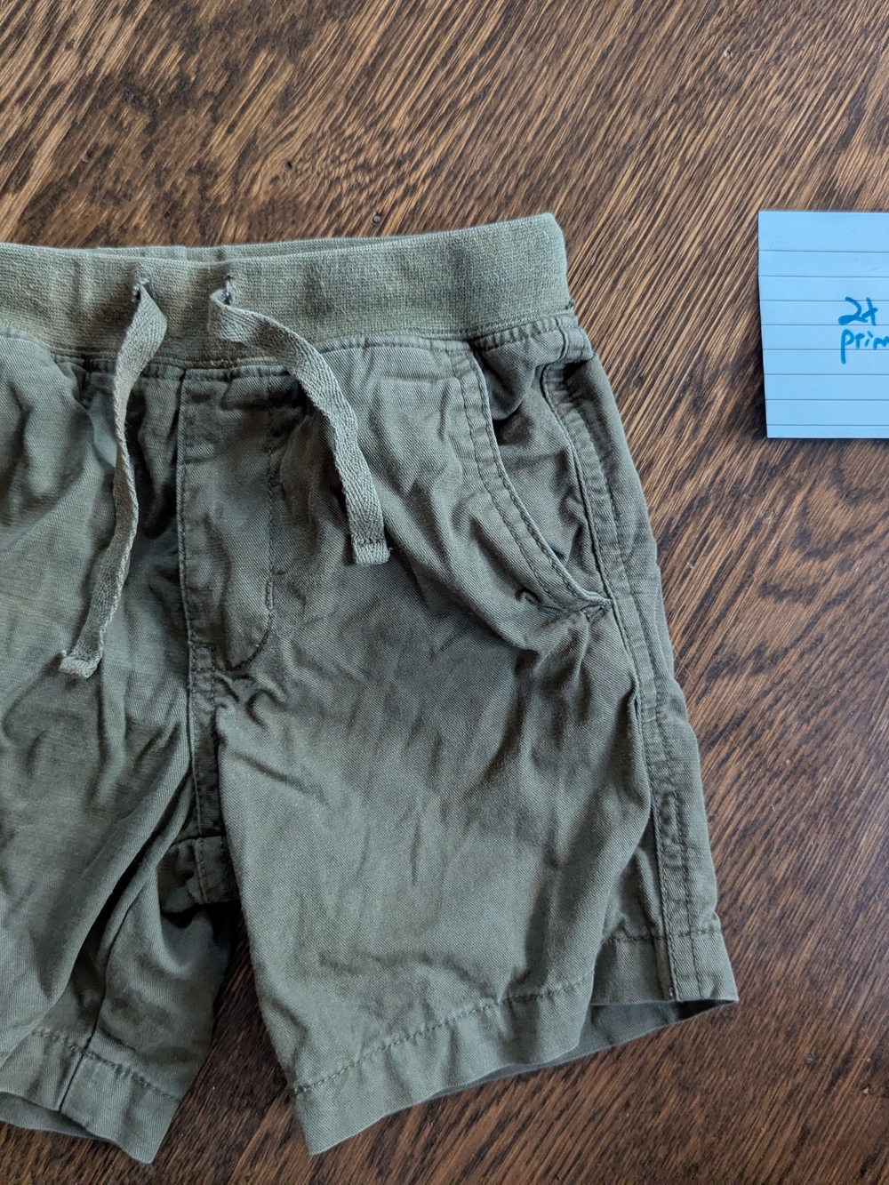 Primary broken twill pull on shorts in olive green, size 2, good condition